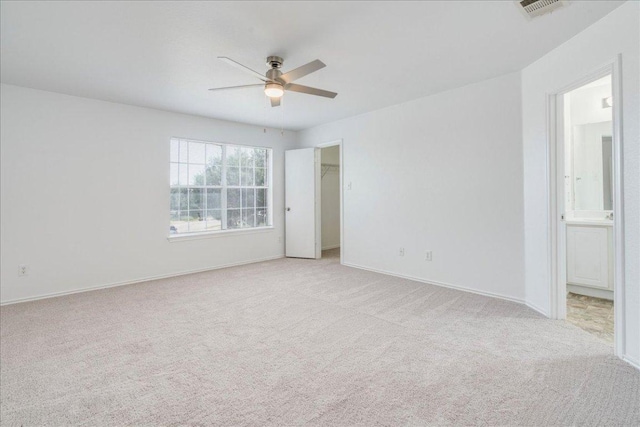 618 Lavaca Loop, Elgin, TX 78621 - spare room featuring light carpet and ceiling fan