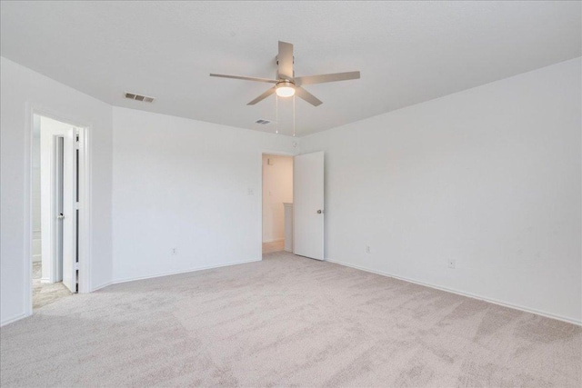 618 Lavaca Loop, Elgin, TX 78621 - spare room with a ceiling fan and light carpet