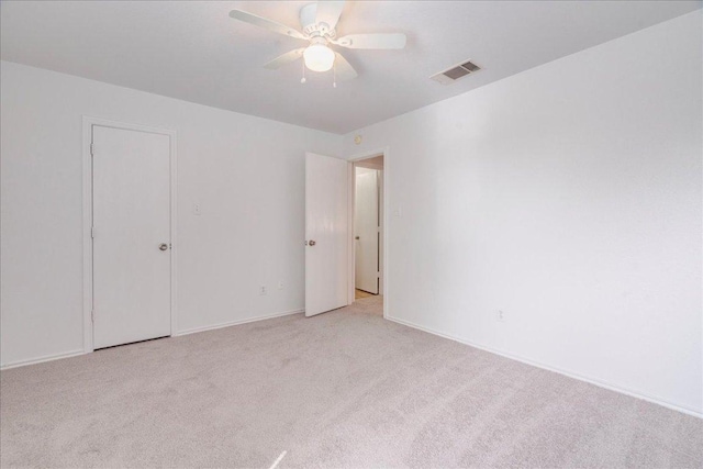 618 Lavaca Loop, Elgin, TX 78621 - unfurnished bedroom with light carpet and a ceiling fan