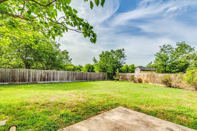 618 Lavaca Loop, Elgin, TX 78621 - fenced backyard with a patio