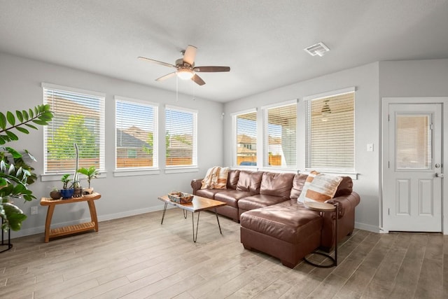 2705 Grizzly Way, Leander, TX 78641 - living area featuring a ceiling fan and wood finished floors