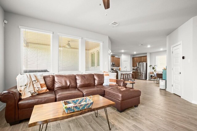 2705 Grizzly Way, Leander, TX 78641 - living room with recessed lighting, ceiling fan, and light wood-style flooring