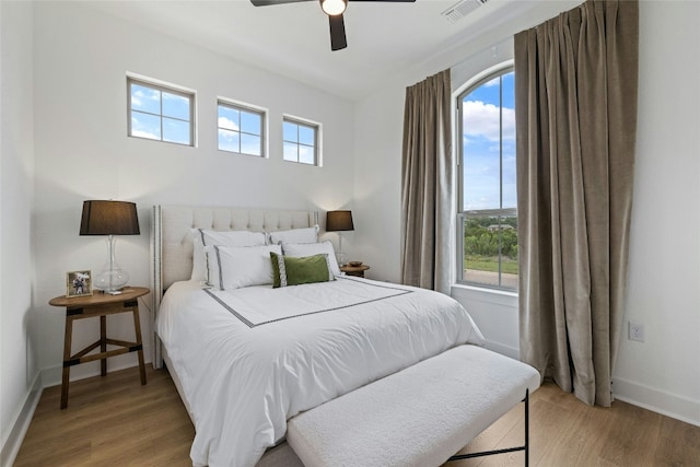 1122 Silver Dollar Trl, Georgetown, TX 78628 - bedroom featuring light wood-type flooring and ceiling fan
