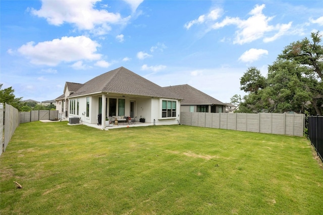 1122 Silver Dollar Trl, Georgetown, TX 78628 - back of property featuring a fenced backyard, stucco siding, a patio, and a shingled roof