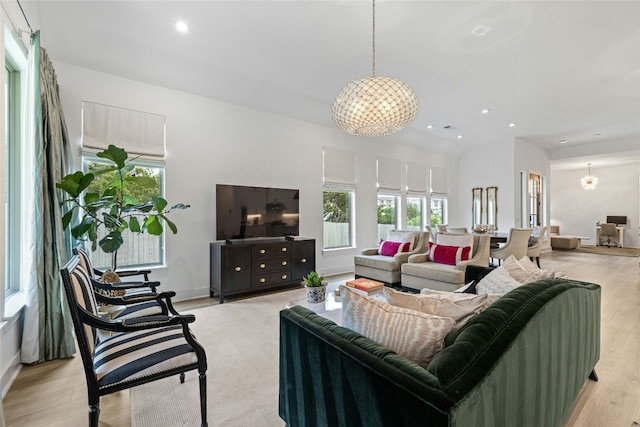 1122 Silver Dollar Trl, Georgetown, TX 78628 - living room featuring a chandelier, light wood-style floors, and recessed lighting