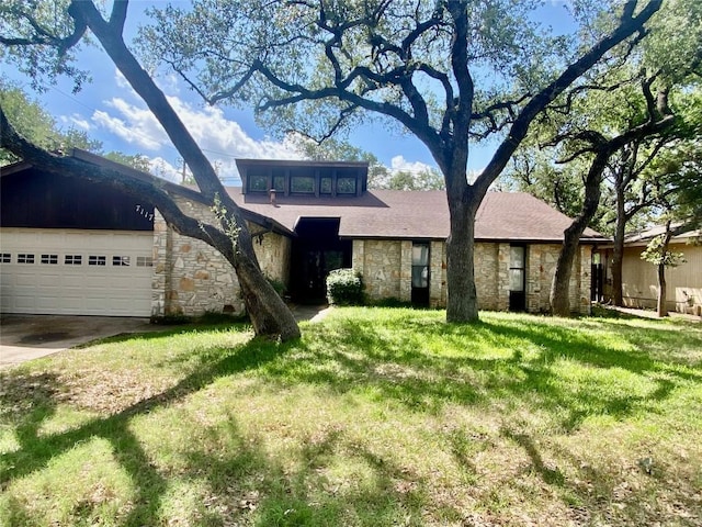 7117 Vallecito Dr, Austin, TX 78759 - mid-century inspired home featuring stone siding, a front yard, concrete driveway, and a garage