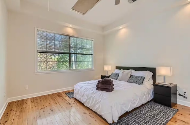1202 Loma Dr, Austin, TX 78741 - bedroom featuring hardwood / wood-style flooring and baseboards