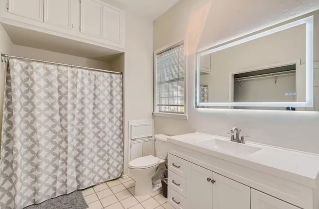 1202 Loma Dr, Austin, TX 78741 - bathroom featuring vanity, tile patterned flooring, and curtained shower