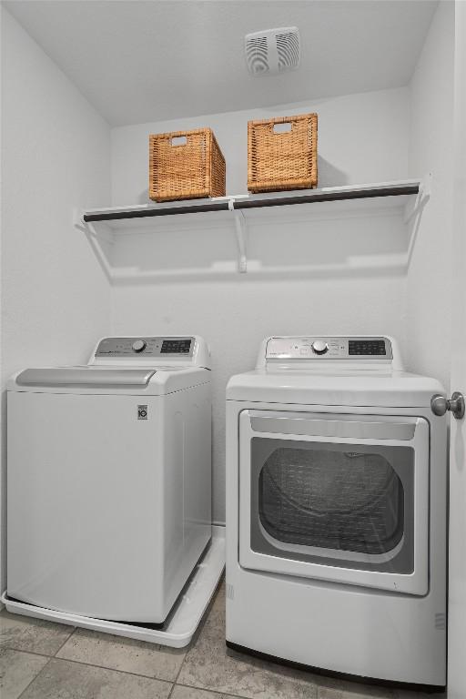 245 Red Buckeye Loop, Liberty Hill, TX 78642 - washroom featuring washer and clothes dryer
