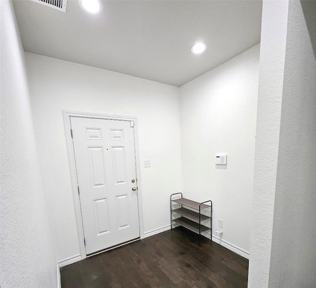 7634 Leonardo Dr, Round Rock, TX 78665 - foyer entrance with dark wood-type flooring and recessed lighting