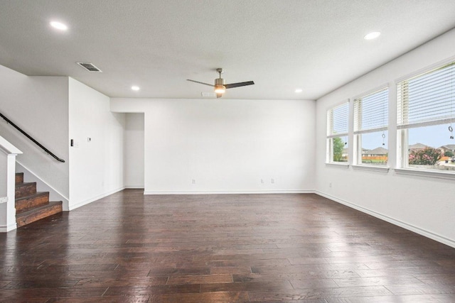 7634 Leonardo Dr, Round Rock, TX 78665 - unfurnished living room with dark wood finished floors, recessed lighting, ceiling fan, and stairway