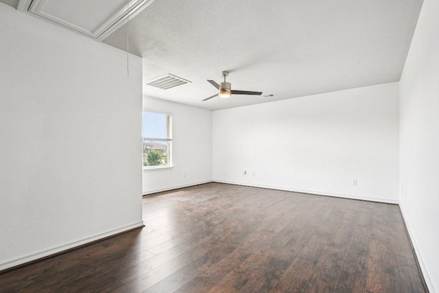 7634 Leonardo Dr, Round Rock, TX 78665 - empty room with attic access, wood finished floors, and a ceiling fan
