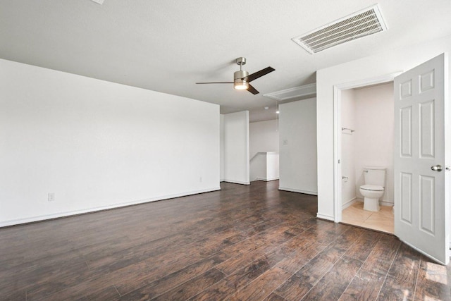 7634 Leonardo Dr, Round Rock, TX 78665 - unfurnished bedroom with wood finished floors, ensuite bath, and a ceiling fan