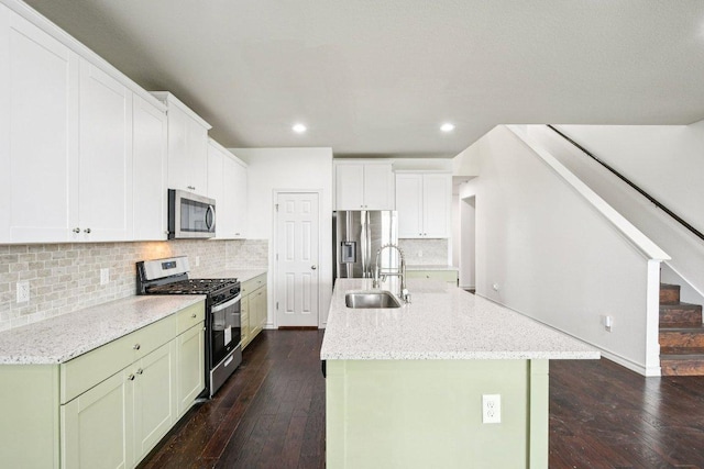 7634 Leonardo Dr, Round Rock, TX 78665 - kitchen featuring appliances with stainless steel finishes, dark wood-style floors, recessed lighting, decorative backsplash, and light stone counters