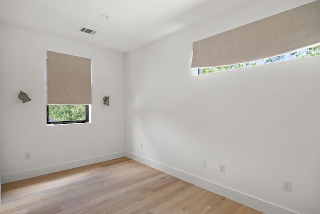 1911 Piedmont Ave, Austin, TX 78757 - unfurnished room featuring healthy amount of natural light and light wood-style flooring