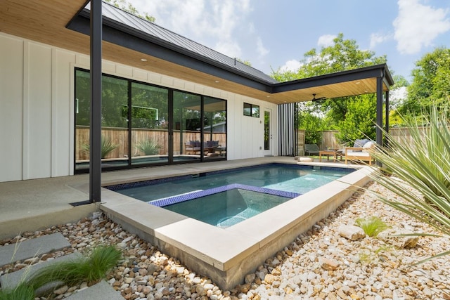 1911 Piedmont Ave, Austin, TX 78757 - view of swimming pool featuring an in-ground hot tub and a fenced backyard