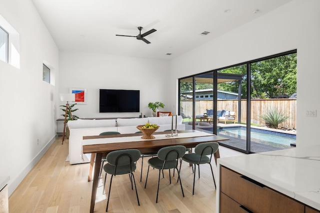 1911 Piedmont Ave, Austin, TX 78757 - dining room featuring a ceiling fan and light wood-type flooring