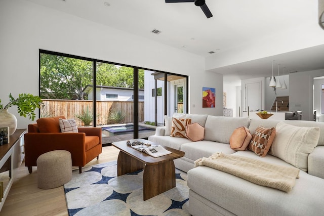 1911 Piedmont Ave, Austin, TX 78757 - living area with light wood-style floors and ceiling fan