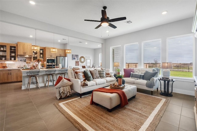 2308 Tobiano Trce, Georgetown, TX 78633 - tiled living area featuring healthy amount of natural light, a ceiling fan, and recessed lighting