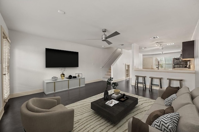 1101 Grove Blvd Unit 206, Austin, TX 78741 - living room featuring stairs, a ceiling fan, and wood finished floors