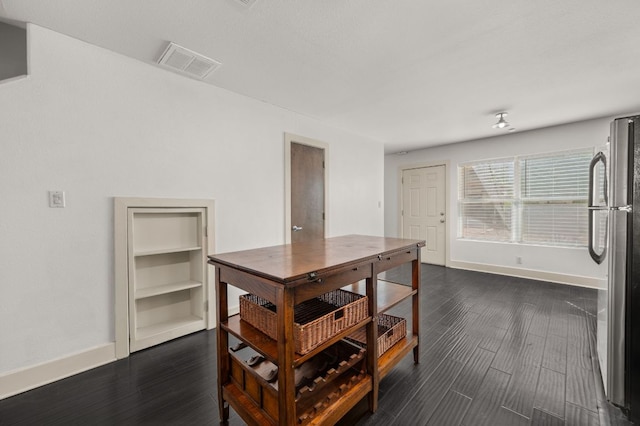 1101 Grove Blvd Unit 206, Austin, TX 78741 - dining area featuring baseboards and dark wood-style flooring