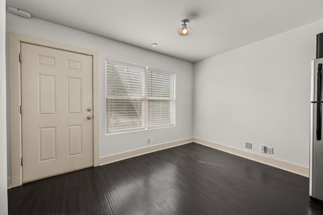 1101 Grove Blvd Unit 206, Austin, TX 78741 - foyer entrance with baseboards and dark wood finished floors