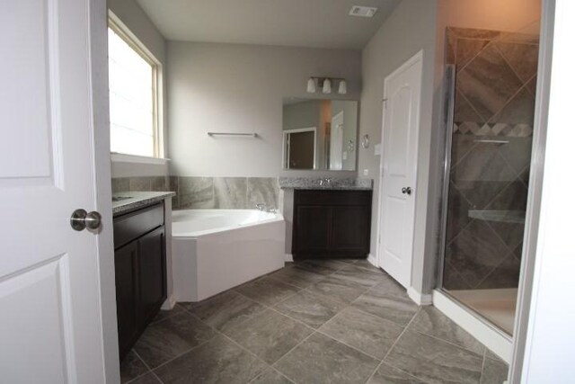 861 Stockdale Rd, Copperas Cove, TX 76522 - bathroom featuring vanity, a bath, and a shower stall