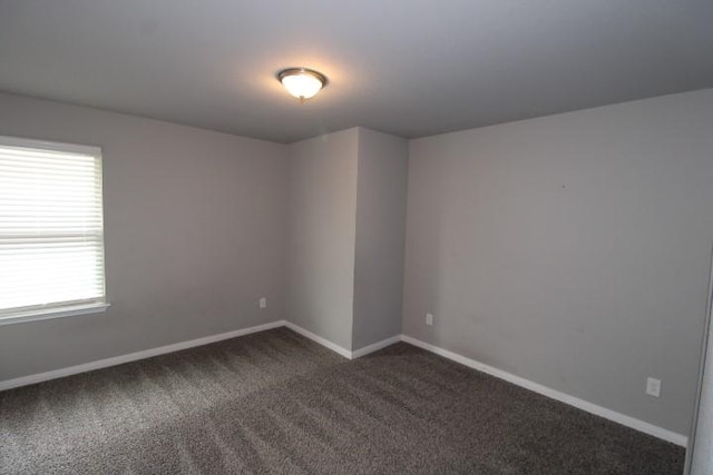 861 Stockdale Rd, Copperas Cove, TX 76522 - spare room featuring dark colored carpet and baseboards