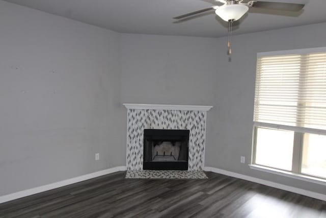 861 Stockdale Rd, Copperas Cove, TX 76522 - unfurnished living room with wood finished floors, ceiling fan, plenty of natural light, and a premium fireplace