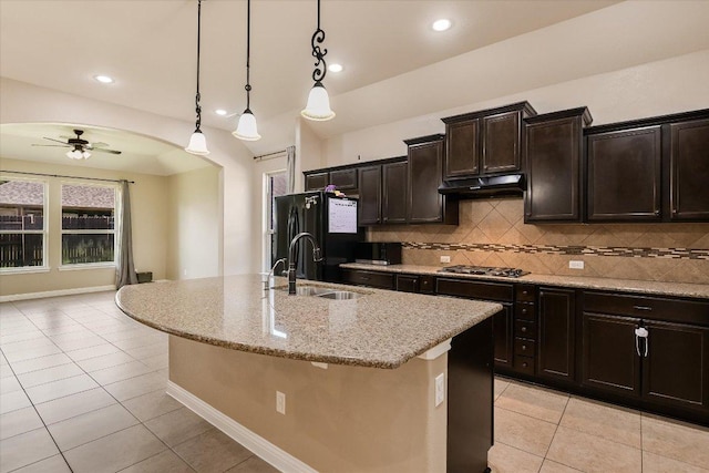 2944 Saint Federico Way, Round Rock, TX 78665 - kitchen with freestanding refrigerator, light tile patterned floors, a ceiling fan, under cabinet range hood, and recessed lighting