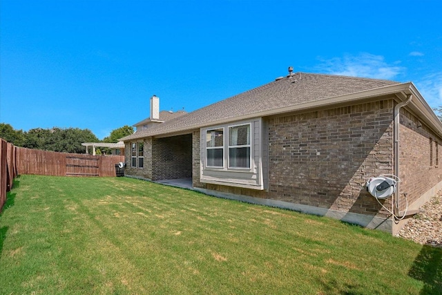 2944 Saint Federico Way, Round Rock, TX 78665 - back of property featuring a fenced backyard, a chimney, and brick siding