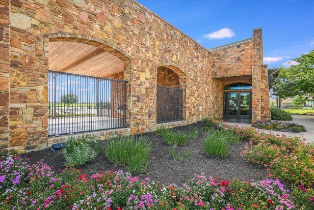2944 Saint Federico Way, Round Rock, TX 78665 - view of front of home featuring french doors and stone siding
