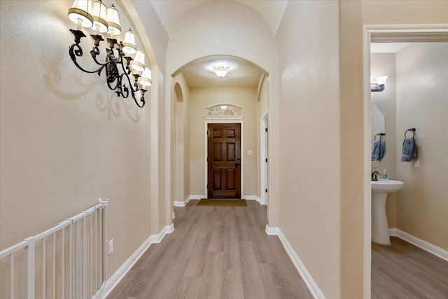 2944 Saint Federico Way, Round Rock, TX 78665 - hall featuring light wood-style flooring and arched walkways