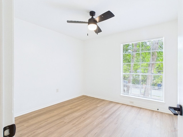 6108 Shadow Valley Dr Unit A, Austin, TX 78731 - empty room with light wood finished floors, healthy amount of natural light, and a ceiling fan