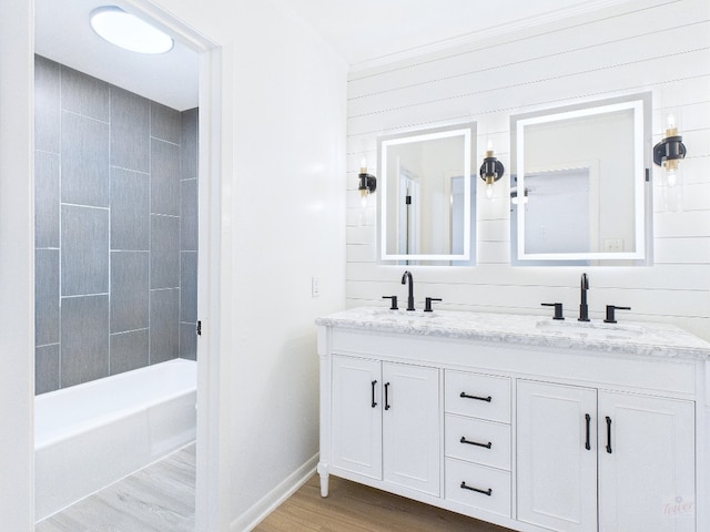 6108 Shadow Valley Dr Unit A, Austin, TX 78731 - bathroom with double vanity, shower / bathtub combination, wood finished floors, and ornamental molding