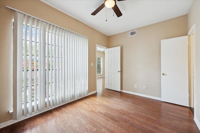 712 W 21st St Unit 202, Austin, TX 78705 - unfurnished bedroom featuring wood finished floors and a ceiling fan