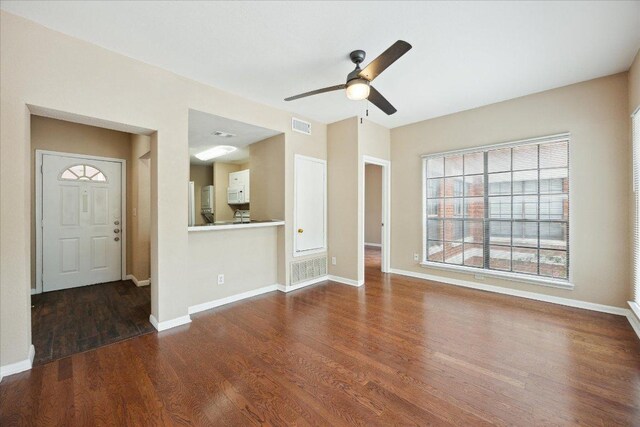 712 W 21st St Unit 202, Austin, TX 78705 - unfurnished living room with wood finished floors and ceiling fan
