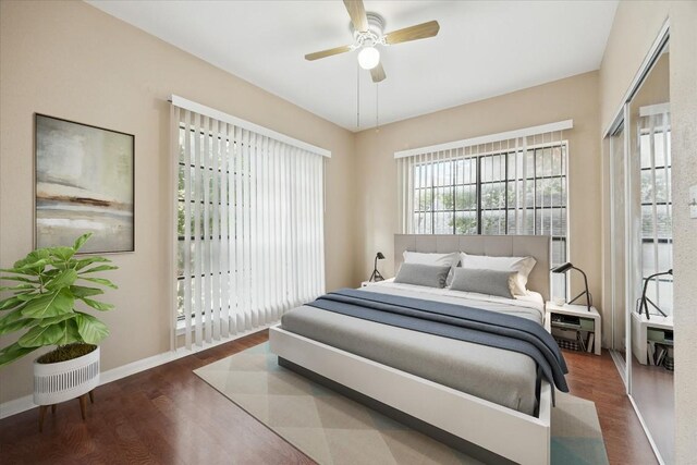 712 W 21st St Unit 202, Austin, TX 78705 - bedroom with wood finished floors and ceiling fan