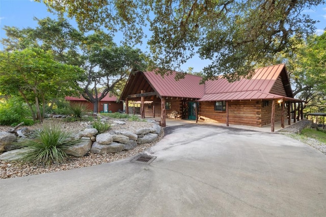 101 Rolling Hills Rd, Blanco, TX 78606 - cabin featuring a standing seam roof, a metal roof, and log exterior