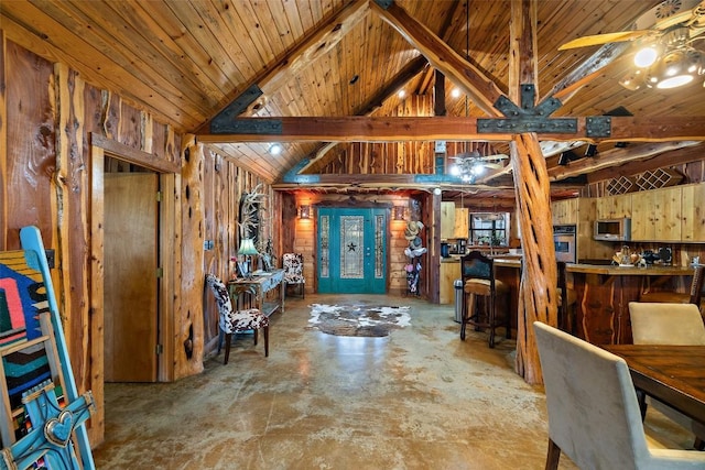 101 Rolling Hills Rd, Blanco, TX 78606 - foyer with wood walls, a ceiling fan, concrete flooring, and wood ceiling
