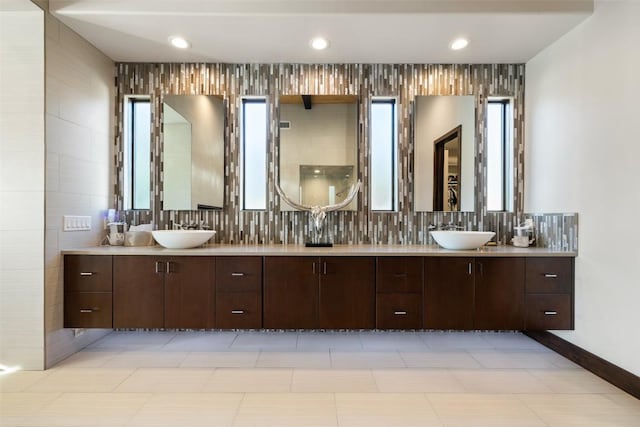 101 Rolling Hills Rd, Blanco, TX 78606 - bathroom featuring double vanity, healthy amount of natural light, recessed lighting, and tasteful backsplash