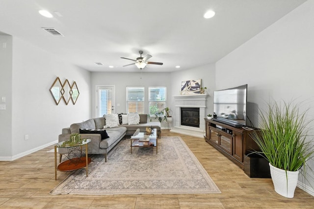 5512 Baythorne Dr, Austin, TX 78747 - living area featuring ceiling fan, recessed lighting, light wood-style floors, and a glass covered fireplace