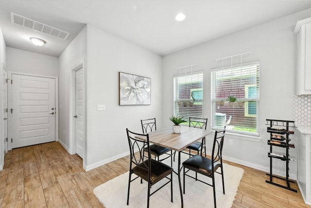5512 Baythorne Dr, Austin, TX 78747 - dining space featuring light wood-type flooring and baseboards