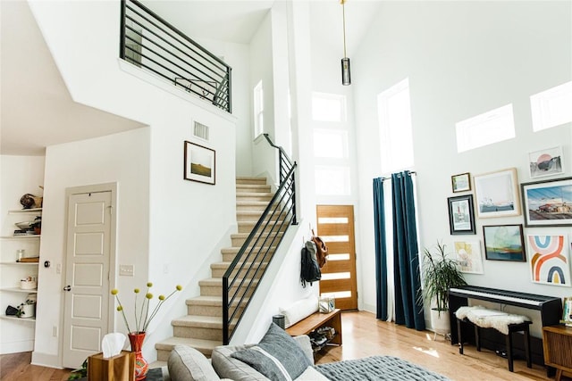 1510 Homespun Rd Unit 79, Austin, TX 78745 - stairway featuring a high ceiling and wood finished floors