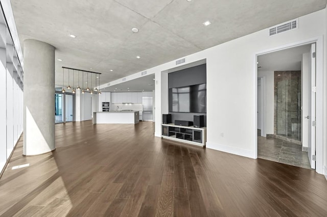 501 W Ave Unit 3201, Austin, TX 78701 - unfurnished living room featuring wood finished floors
