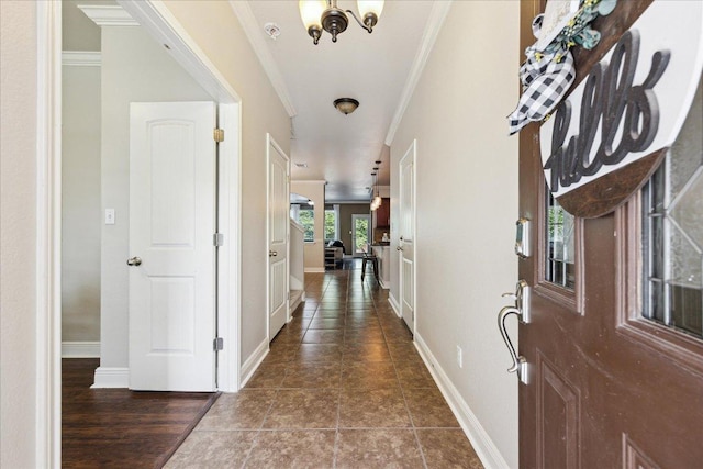 9520 Sydney Marilyn Ln, Austin, TX 78748 - foyer entrance with ornamental molding and a chandelier