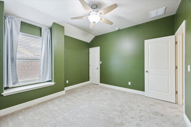 9520 Sydney Marilyn Ln, Austin, TX 78748 - unfurnished bedroom featuring carpet flooring, vaulted ceiling, and ceiling fan
