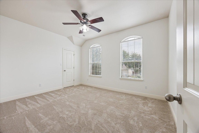 9520 Sydney Marilyn Ln, Austin, TX 78748 - spare room featuring light colored carpet, ceiling fan, and vaulted ceiling