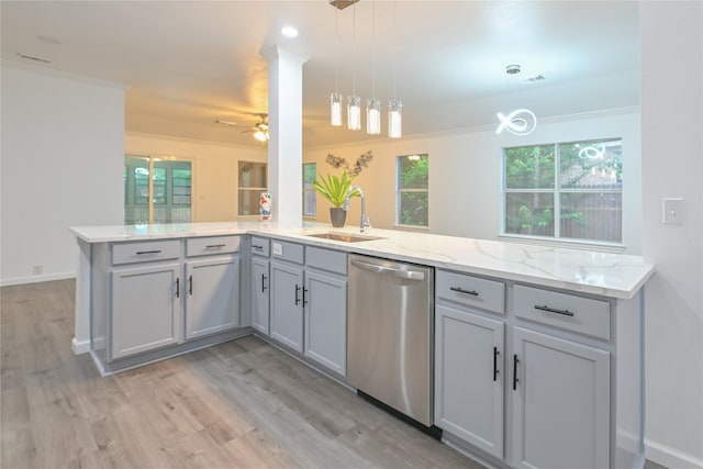 910 Rocking Spur Cv, Pflugerville, TX 78660 - kitchen featuring dishwasher, a peninsula, light wood-style flooring, a ceiling fan, and light stone countertops