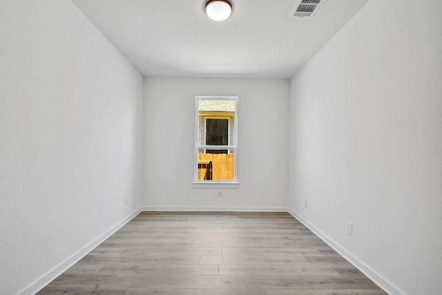 596 Biscayne Bay Bnd, Kyle, TX 78640 - unfurnished room featuring wood finished floors and baseboards